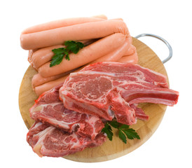 Raw Lamb chops and Beef Sausages isolated over white background