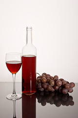 drink series: red wine glass and bottle with grapes
