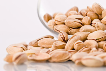 food serias: macro picture of scattered pistachio nuts
