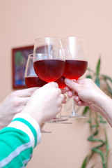 Picture of several people celebrating and drinking wine