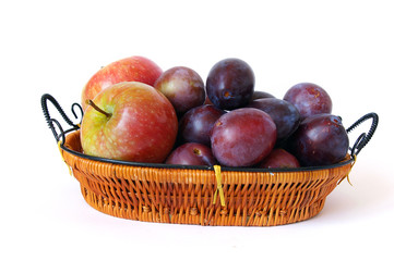 Basket of fruits isolated on a white background