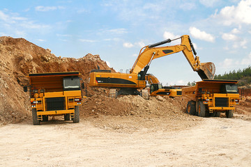 BACKHOE LOADER LOADING DUMPER
