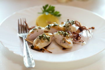 grilled squid stuffed with ham and cheese close up
