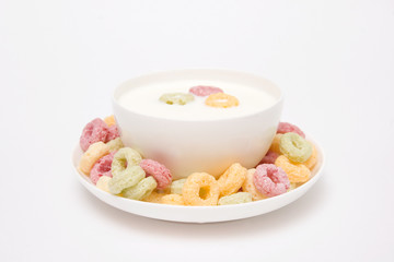 Corn flakes and milk, isolated on white