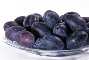 Plums on white background