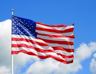 US Flag Against a Vibrant Blue Sky