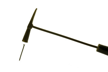 Hammer on the pin isolated on wihte