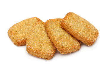 Many pieces of cookies stacked on white background.