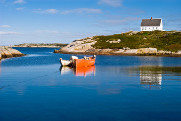 Fisherman's house and boats in a bay. Peggy's cove, Canada.