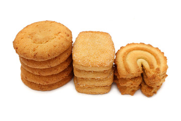 Many pieces of cookies stacked on white background.