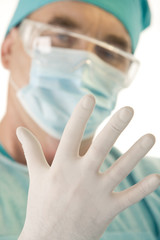 Close-up of surgeon’s hand wearing sterile glove