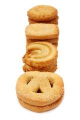 Many pieces of cookies stacked on white background.