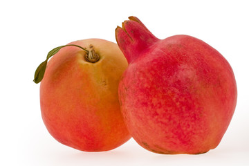 Ripe red pomegranate on a white background