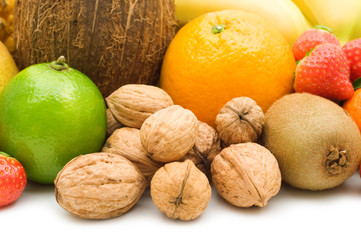 walnuts and fruits on white background