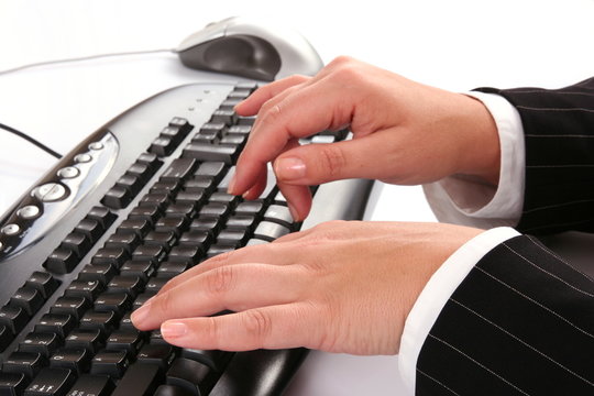 Woman typing on the computer keyboard