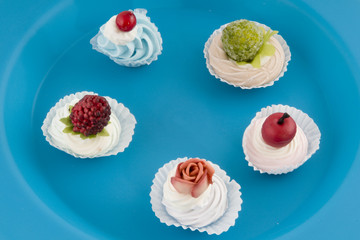 Fancy little cakes with whipped cream