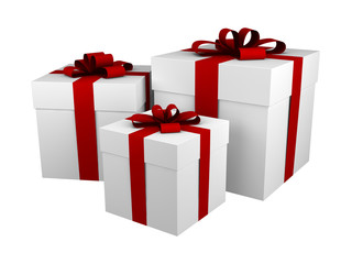 three white gift boxes with red ribbon and bow isolated on white