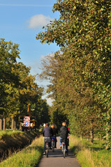 children coming by bicylce from school