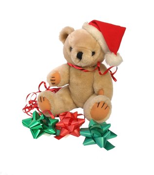 Christmas teddy bear with coloured bows and ribbon