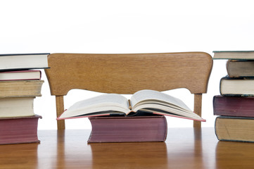 An empty desk with books ready to be read.