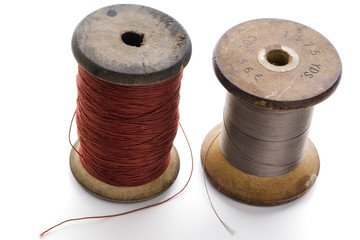 couple of spools of thread on white
