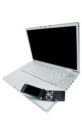 Mobile phone on the keyboard of a laptop