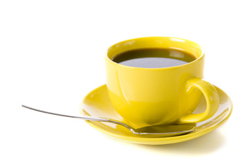 A yellow cup of coffee on a white background