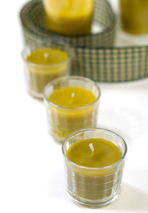five yellow candles and green ribbon