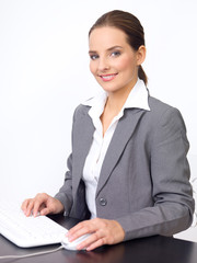 beautiful and young business woman working on computer