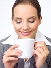 Portrait of beautiful and young business woman with coffee cup