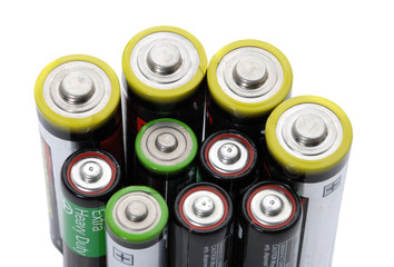 Several AA  batteries on white background energy concept