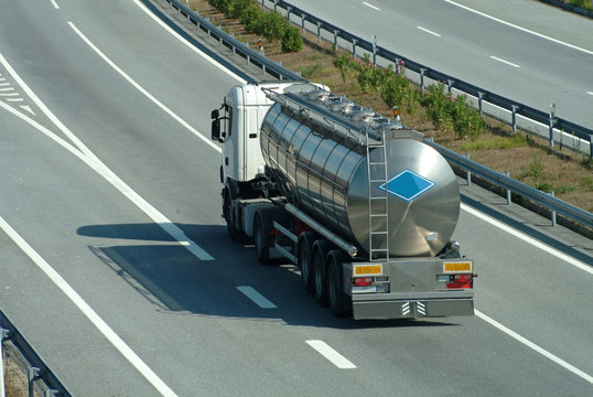 Large Tanker Truck Rolling On Highway