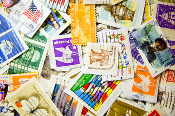 A collection of U.S. stamps in a pile