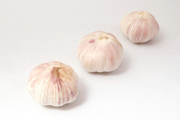 Garlic on white cloth, isolated