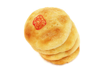 Chinese cream pastry stacked together on white background.