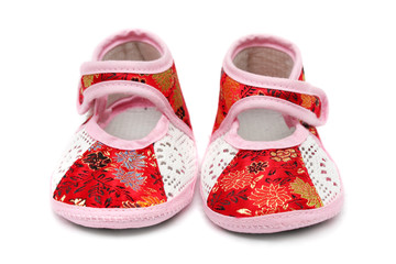 A pair of baby shoes isolated on white background.