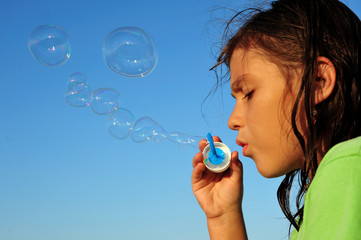 Blowing soap bubbles