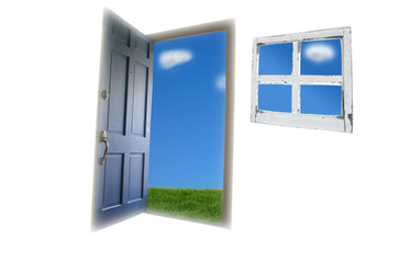Door opening to green grass and blue sky