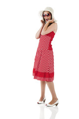 young woman isolated on white with a hat and sunglasses