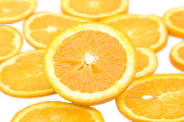 Fresh orange and slices on a white bacground