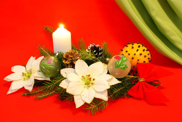 christmas wreath and orange on red background