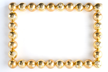 Border Made From Gold Baubles Against White Background