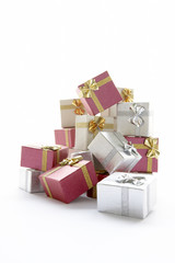 Pile Of Christmas Presents Against White Background