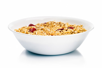 White dish of oat with milk and strawberries