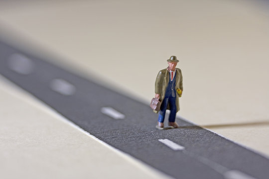 Man on road shallow depth of field