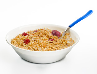 Dish of oat with strawberries with spoon