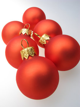 fur-tree toys spheres of red color on  white background