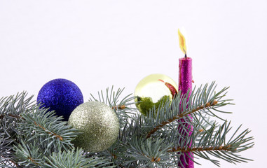 Christmas balls and candle with branches