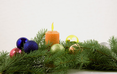 Christmas balls and candle with branches