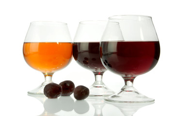 Dark wine in glasses on a glass table     grapes